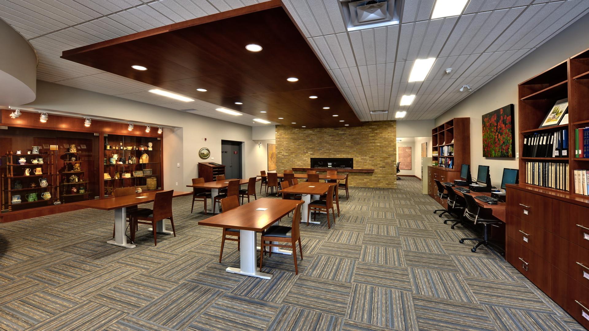 Archives reading room with bookshelves and wooden tables and chairs